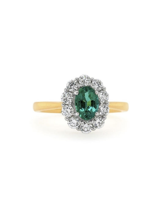 7x5mm Emerald & 0.70 Carat Diamond Cluster ring, 18 Carat Yellow Gold